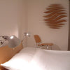 minimaproject-wave-wooden-hanging-art-in-bedroom | ikonitaly