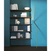 nemo-neo-leaning-floor-lamp-gold-next-to-bookshelf | ikonitaly