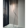 nemo-neo-leaning-floor-lamp-next-to-black-curtain | ikonitaly